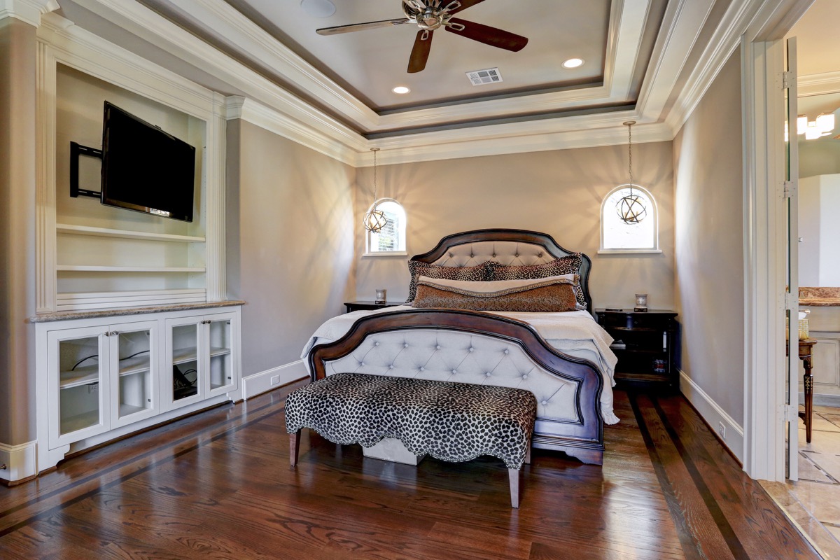 The master bedroom flooring is accented with beautiful contrasted borders