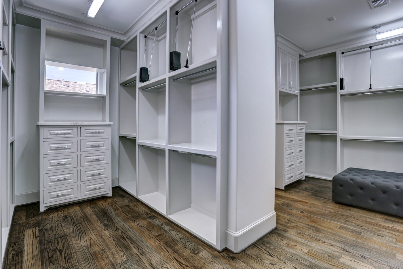 Spacious master closet has pull-downs for optimal use of the high ceilings