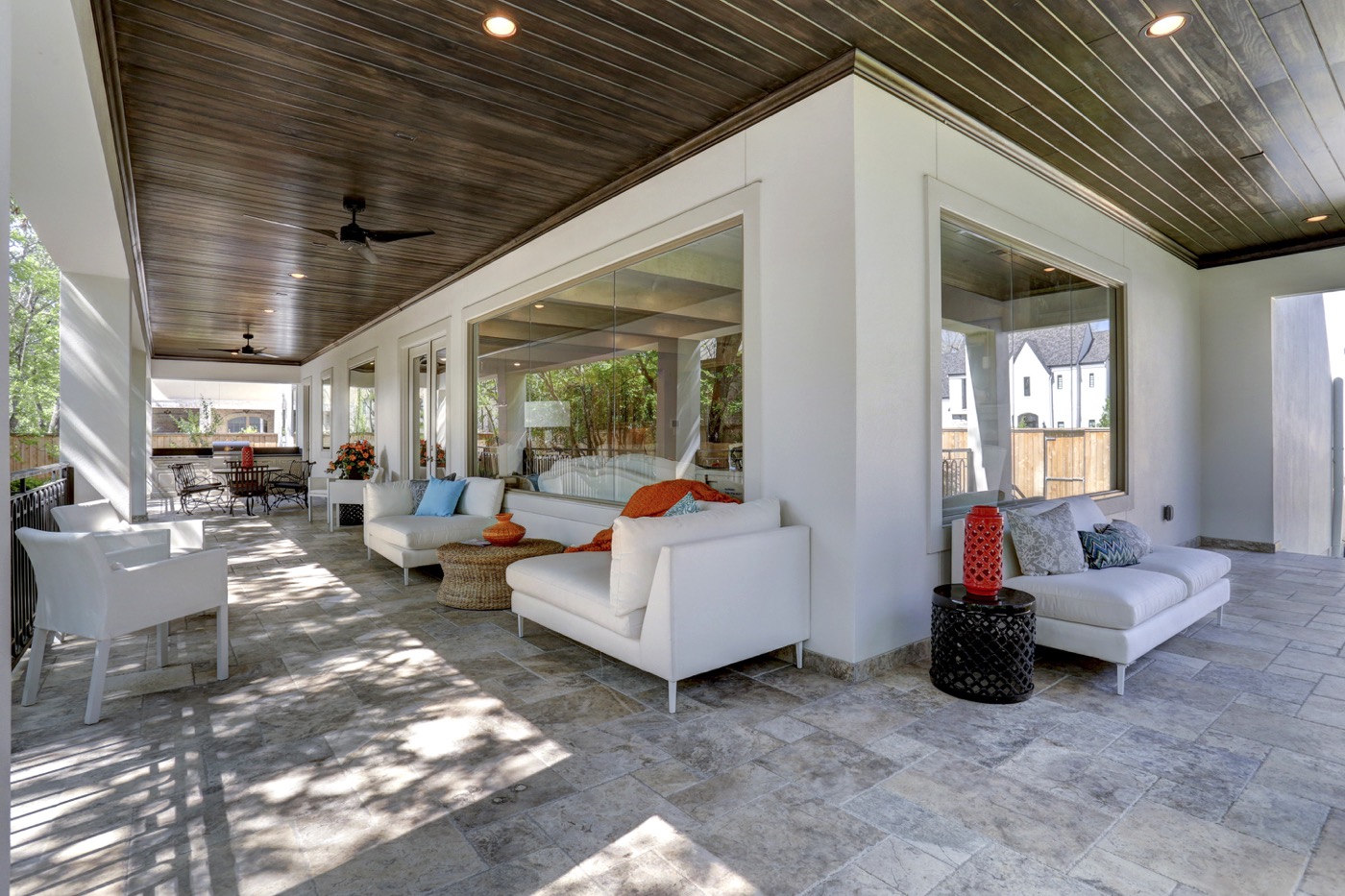 This spacious and shaded outdoor loggia doubles as a secondary living room and dining room